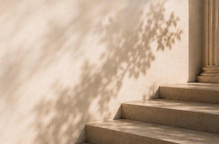 Sunlight and foliage shadows on classical stone steps